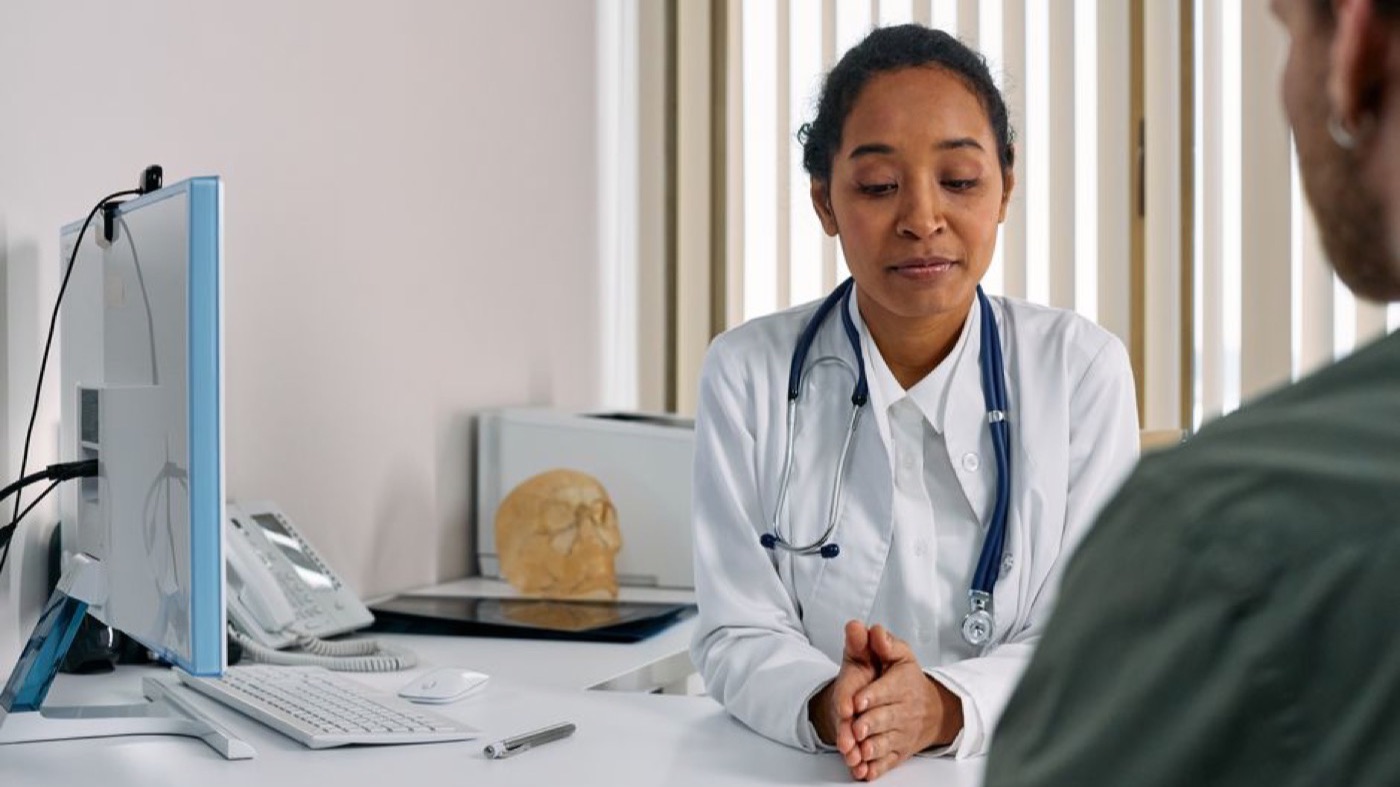 A woman talking with her physician