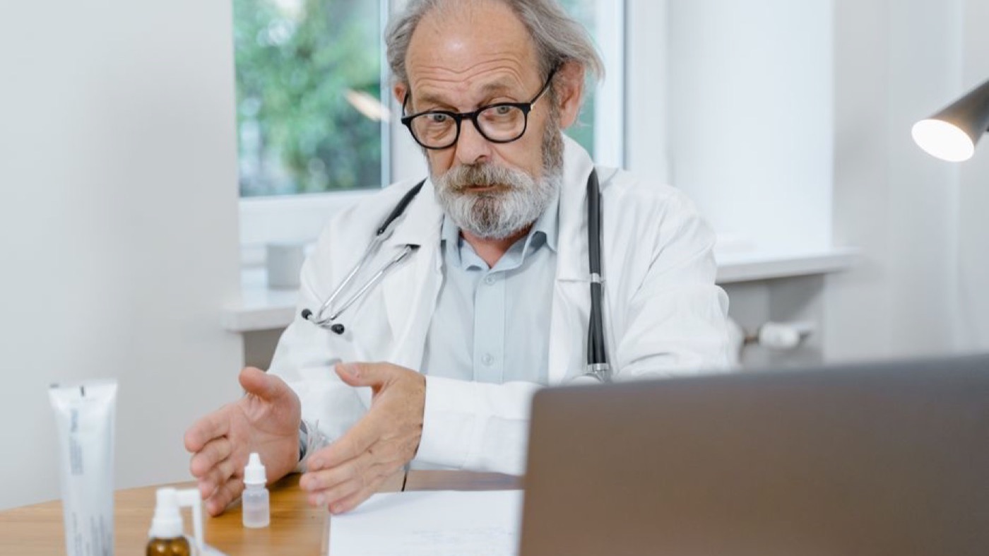 A man in consultation with his physician